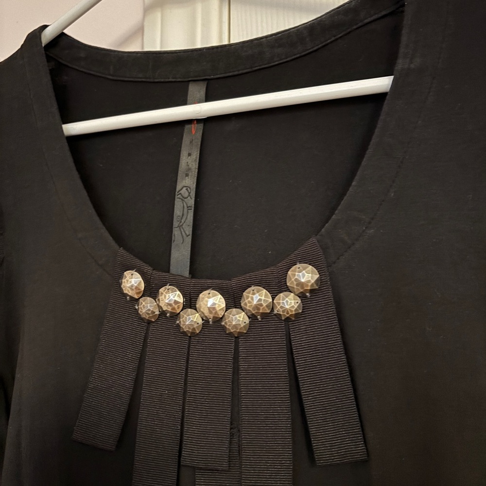 Elegant Black Top with Embellished Neckline